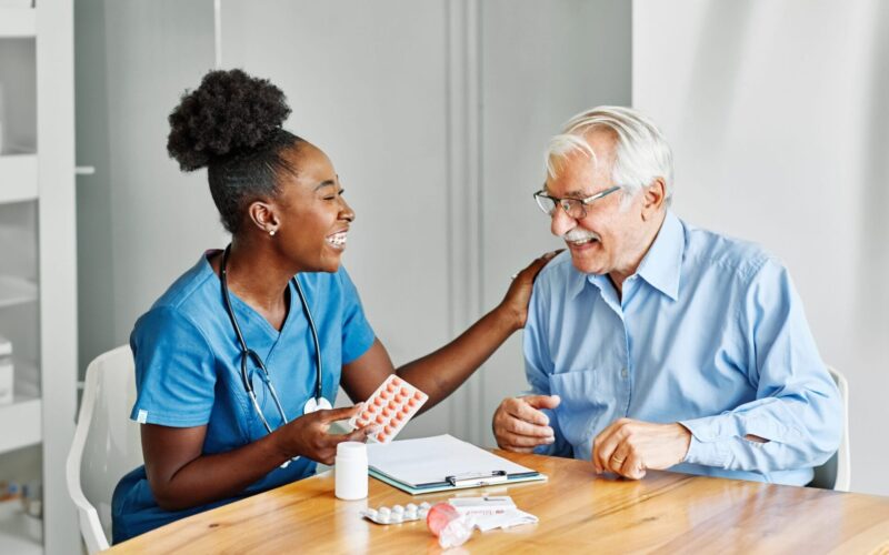 Doctor,Or,Nurse,Caregiver,Showing,A,Prescrption,Or,Documents,And Doctor,Or,Nurse,Caregiver,Showing,A,Prescrption,Or,Documents,And