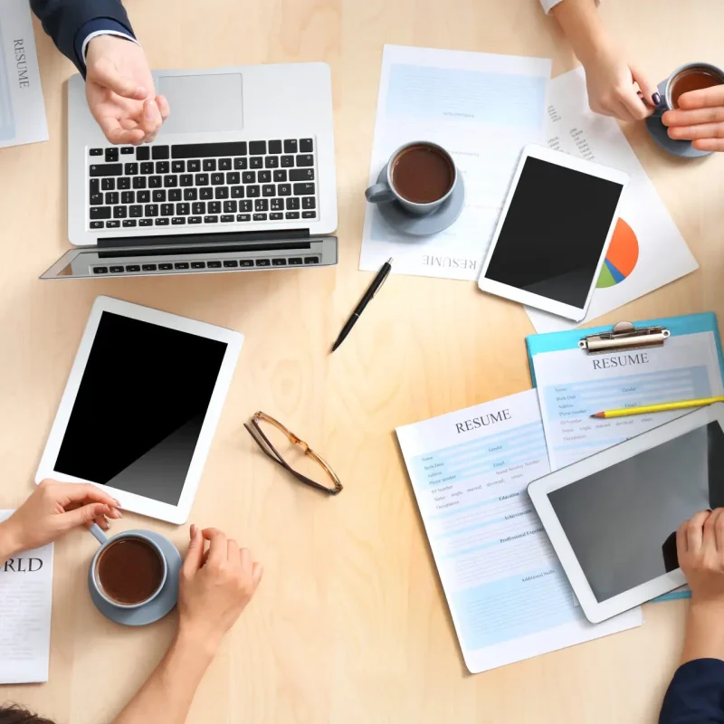 Group,Of,Business,People,Working,At,Desk,,Top,View